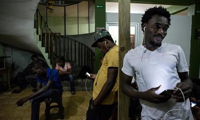 Migrants gather in a hotel known as Mama Africa in downtown Tapachula, which is almost exclusively African. Photograph: Encarni Pindado for the Guardian